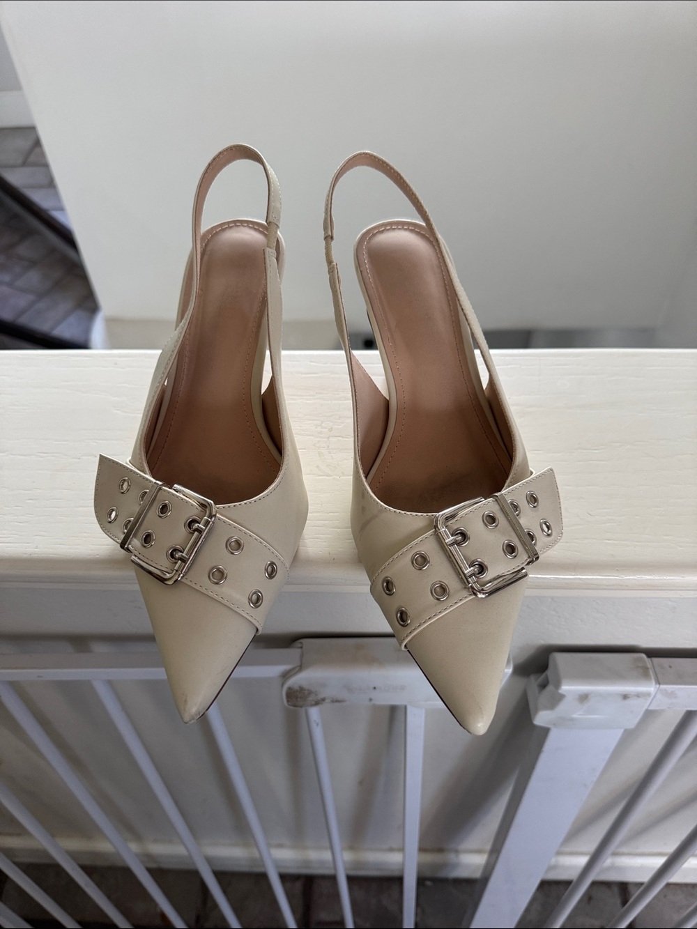 Cream Pointed Slingback Pumps with Buckle Detail.